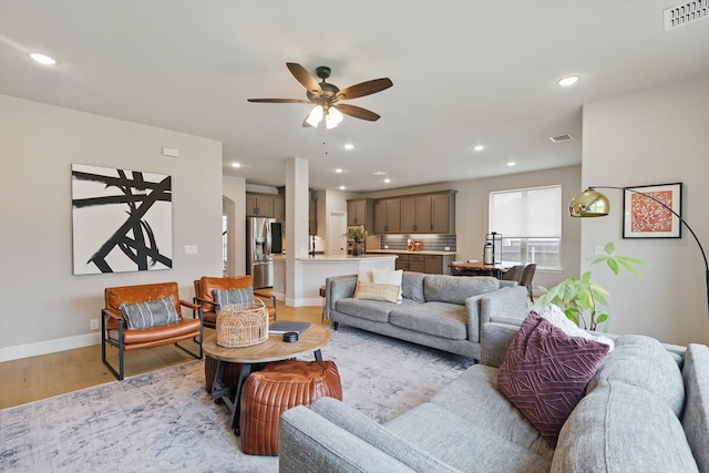 9208 Amistad Ln, Denton, TX 76226 - living area with light wood finished floors, a ceiling fan, baseboards, recessed lighting, and visible vents
