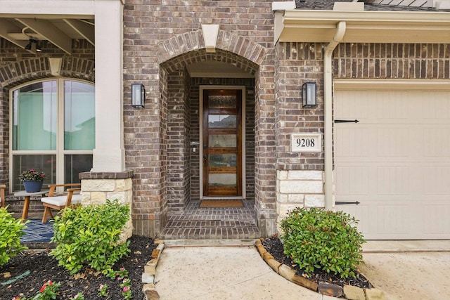 9208 Amistad Ln, Denton, TX 76226 - entrance to property with a garage and brick siding