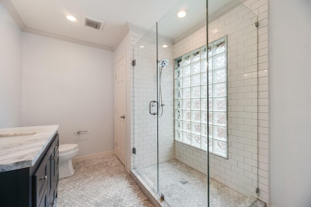 full bath featuring visible vents, crown molding, a stall shower, and vanity