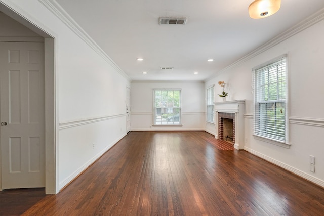 unfurnished living room featuring visible vents, baseboards, wood finished floors, and a fireplace