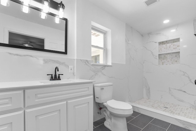 3617 Walton Ave, Fort Worth, TX 76133 - full bath with vanity, toilet, a marble finish shower, tile walls, and visible vents