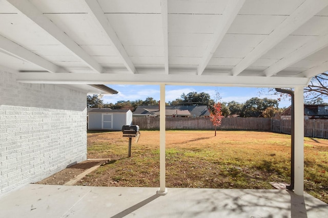 3617 Walton Ave, Fort Worth, TX 76133 - view of yard featuring a storage shed, an outdoor structure, a fenced backyard, and a patio area