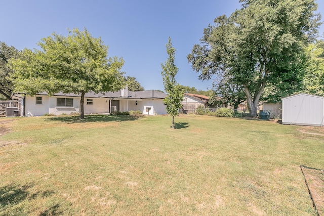 3617 Walton Ave, Fort Worth, TX 76133 - view of yard featuring fence, central AC unit, an outdoor structure, and a storage unit