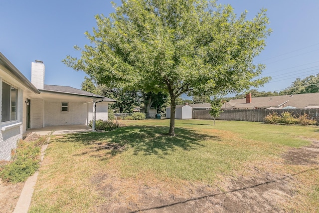 3617 Walton Ave, Fort Worth, TX 76133 - view of yard with a storage shed, a patio, fence, and an outbuilding