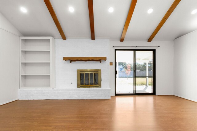 3617 Walton Ave, Fort Worth, TX 76133 - unfurnished living room with lofted ceiling with beams, a fireplace, built in shelves, recessed lighting, and wood finished floors