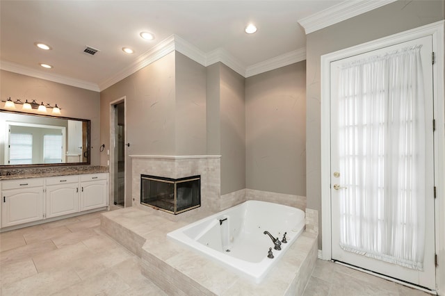 full bath with a tub with jets, a fireplace, visible vents, vanity, and recessed lighting