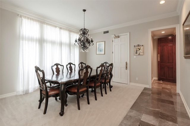 dining area with a notable chandelier, visible vents, ornamental molding, and baseboards