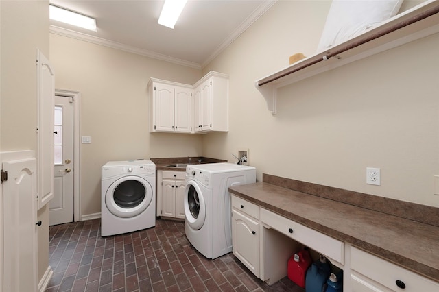clothes washing area featuring cabinet space, crown molding, brick floor, separate washer and dryer, and baseboards