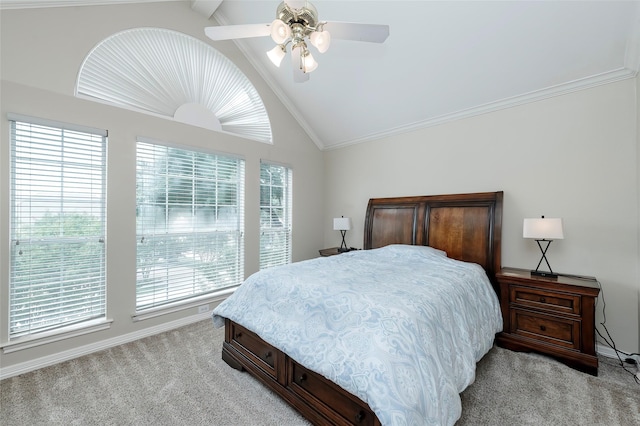bedroom with ornamental molding, light carpet, vaulted ceiling, and ceiling fan