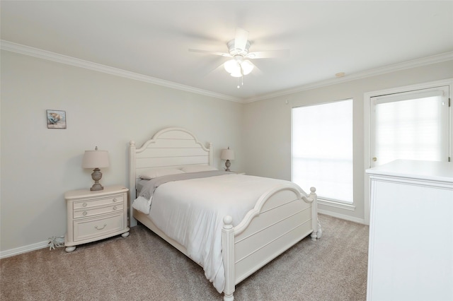 bedroom featuring light colored carpet, ornamental molding, baseboards, and a ceiling fan