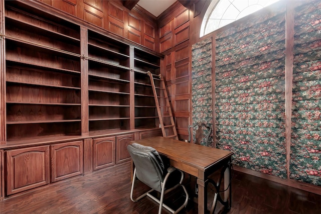 unfurnished office featuring baseboards and dark wood-style floors
