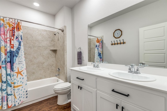 2224 Miramar Dr, Little Elm, TX 75068 - bathroom with toilet, a sink, shower / tub combo, and wood finished floors