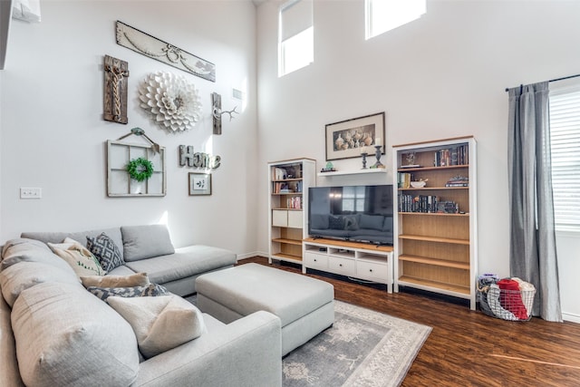 2224 Miramar Dr, Little Elm, TX 75068 - living area with dark wood-style flooring and a towering ceiling