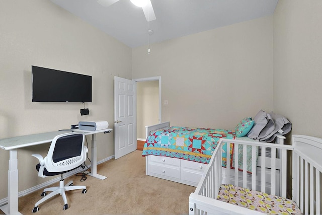 bedroom featuring baseboards, a ceiling fan, and light colored carpet