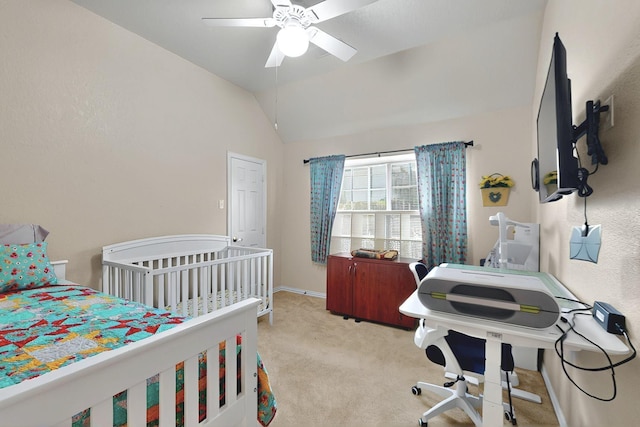 bedroom with vaulted ceiling, baseboards, ceiling fan, and carpet flooring