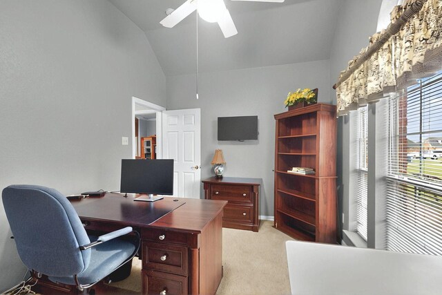 office space with high vaulted ceiling, ceiling fan, and light colored carpet