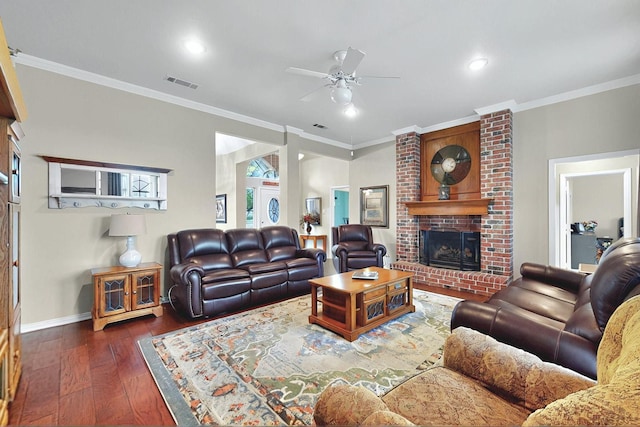living room featuring ceiling fan, a fireplace, wood-type flooring, baseboards, and visible vents