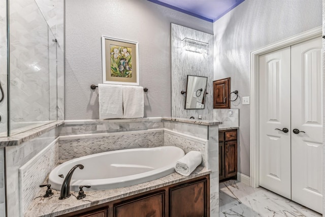 245 Prairie Oak Ct, Burleson, TX 76028 - full bath with a garden tub, vanity, marble finish flooring, and a textured wall