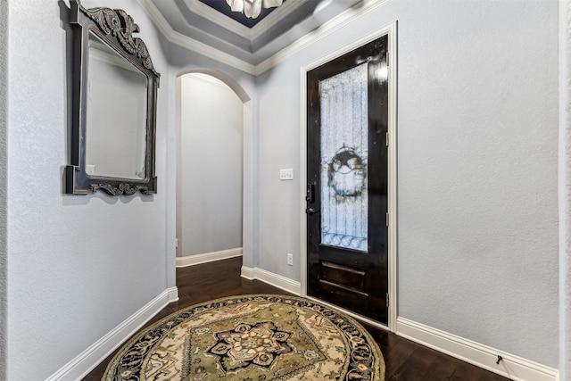 245 Prairie Oak Ct, Burleson, TX 76028 - foyer entrance with dark wood-type flooring, ornamental molding, arched walkways, and baseboards