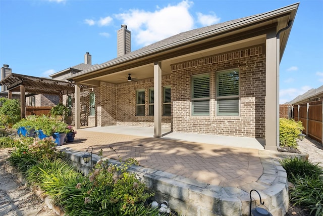245 Prairie Oak Ct, Burleson, TX 76028 - back of house featuring brick siding, ceiling fan, a pergola, a patio area, and a chimney