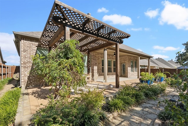 245 Prairie Oak Ct, Burleson, TX 76028 - rear view of house featuring brick siding, a pergola, a patio area, and roof with shingles