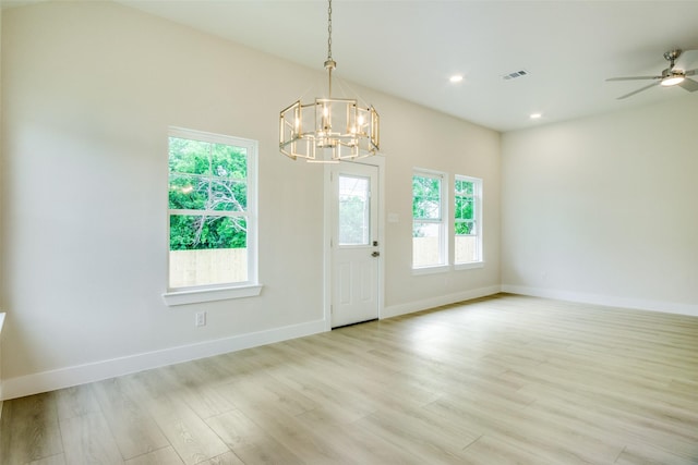 interior space featuring plenty of natural light, baseboards, and light wood-type flooring