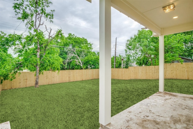 view of yard with a fenced backyard and a patio