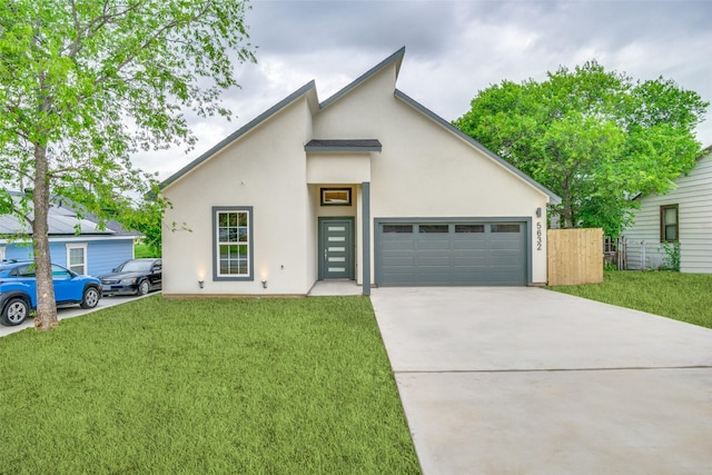 view of front facade featuring an attached garage, a front lawn, stucco siding, and driveway