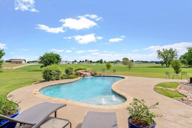 pool featuring a patio and a yard