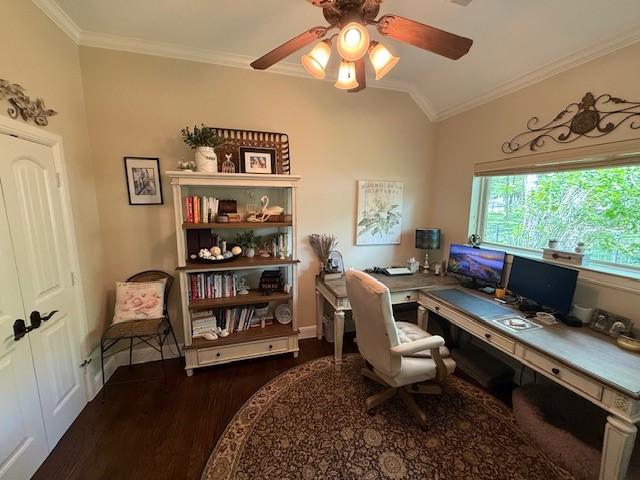 home office featuring ornamental molding, wood finished floors, lofted ceiling, baseboards, and ceiling fan