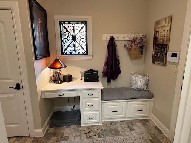 mudroom featuring built in study area