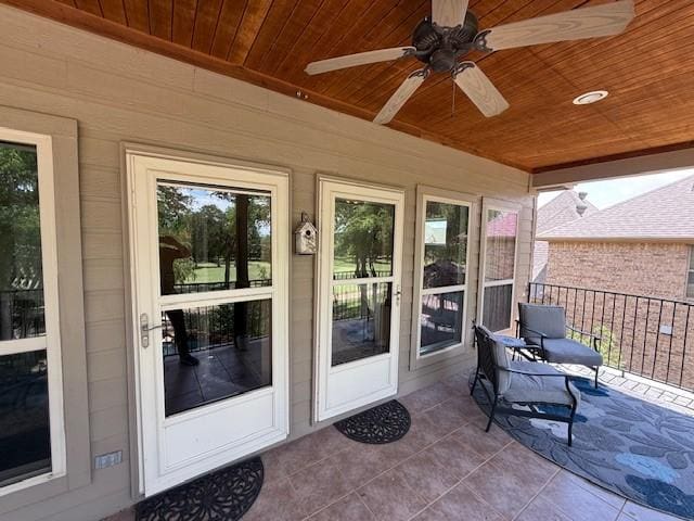 property entrance with ceiling fan