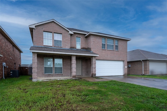 traditional-style house with driveway, a front yard, a garage, brick siding, and central AC