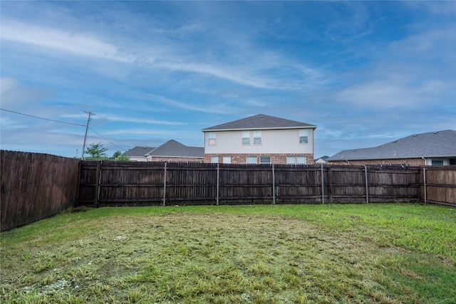 view of yard featuring a fenced backyard