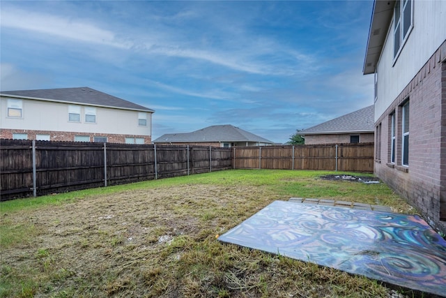 view of yard with a fenced backyard