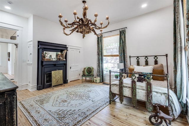 805 Howell St, Mckinney, TX 75069 - living room featuring light wood finished floors, a chandelier, recessed lighting, and baseboards