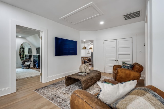805 Howell St, Mckinney, TX 75069 - living area with baseboards, visible vents, attic access, and light wood-type flooring