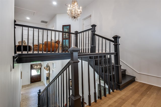 805 Howell St, Mckinney, TX 75069 - staircase featuring an inviting chandelier, recessed lighting, visible vents, and wood finished floors