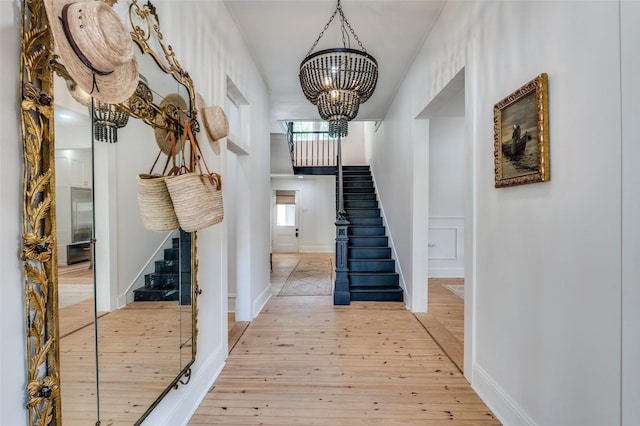 805 Howell St, Mckinney, TX 75069 - foyer entrance featuring stairway, baseboards, hardwood / wood-style flooring, and a notable chandelier