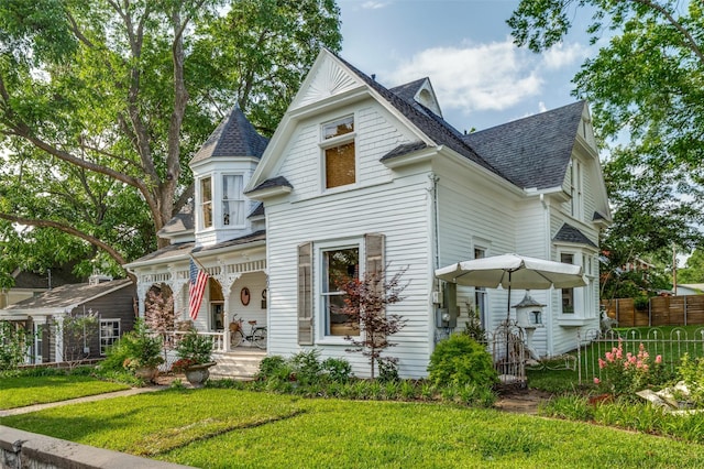 805 Howell St, Mckinney, TX 75069 - victorian house with covered porch and a shingled roof