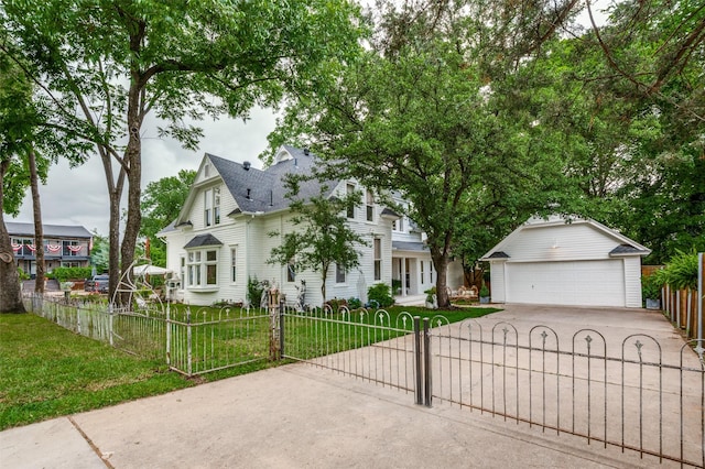 805 Howell St, Mckinney, TX 75069 - view of front facade with an outbuilding, a detached garage, and a shingled roof