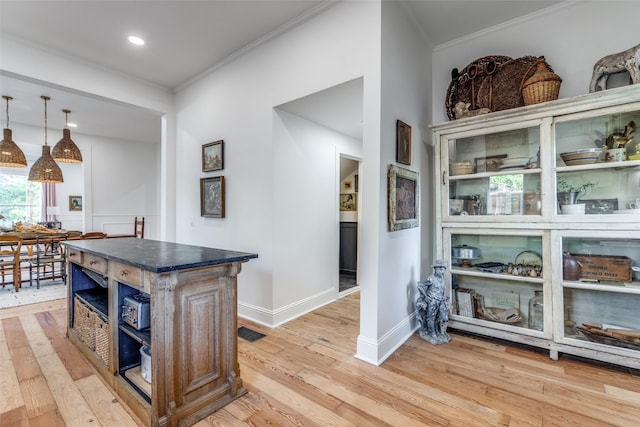 805 Howell St, Mckinney, TX 75069 - kitchen featuring light wood-style floors, a center island, and crown molding