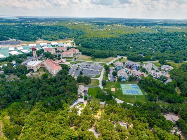 2164 Tanglewood Blvd Unit A105, Pottsboro, TX 75076 - aerial view featuring a wooded view