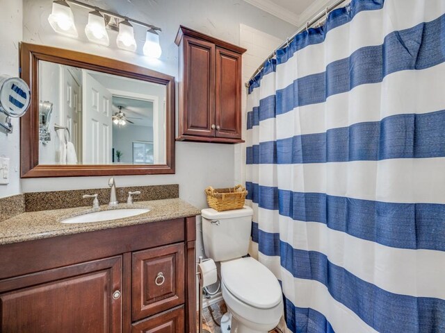 2164 Tanglewood Blvd Unit A105, Pottsboro, TX 75076 - bathroom with ceiling fan, crown molding, vanity, toilet, and a shower with shower curtain