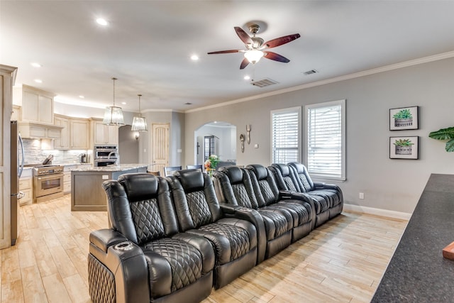 2417 Roosevelt Ave, Fort Worth, TX 76164 - living room with arched walkways, ceiling fan, visible vents, and light wood-type flooring