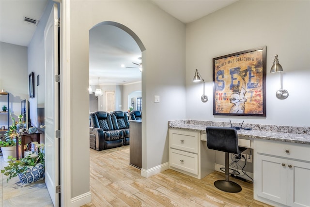 2417 Roosevelt Ave, Fort Worth, TX 76164 - office space with a ceiling fan, visible vents, arched walkways, light wood-type flooring, and baseboards