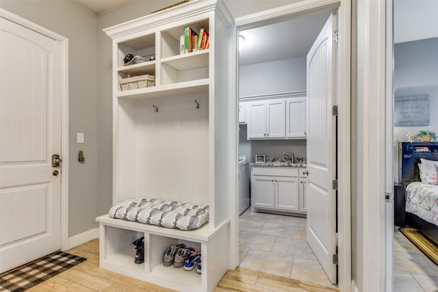 2417 Roosevelt Ave, Fort Worth, TX 76164 - mudroom featuring baseboards and a sink