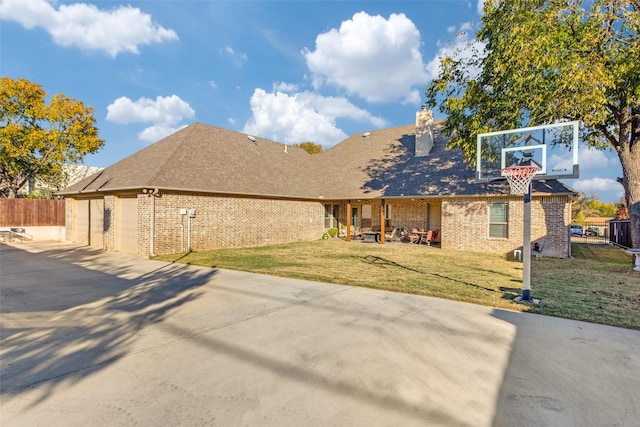 2417 Roosevelt Ave, Fort Worth, TX 76164 - rear view of property with driveway, a chimney, a lawn, brick siding, and fence