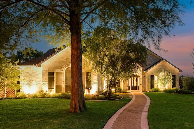 obstructed view of property featuring a front yard