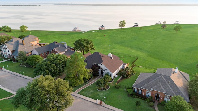 birds eye view of property featuring a water view and a residential view